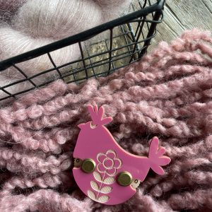 Soft pink bulky yarn for knitting or crochet projects.