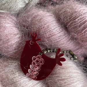 Soft pink fluffy yarn for knitting or crochet projects.