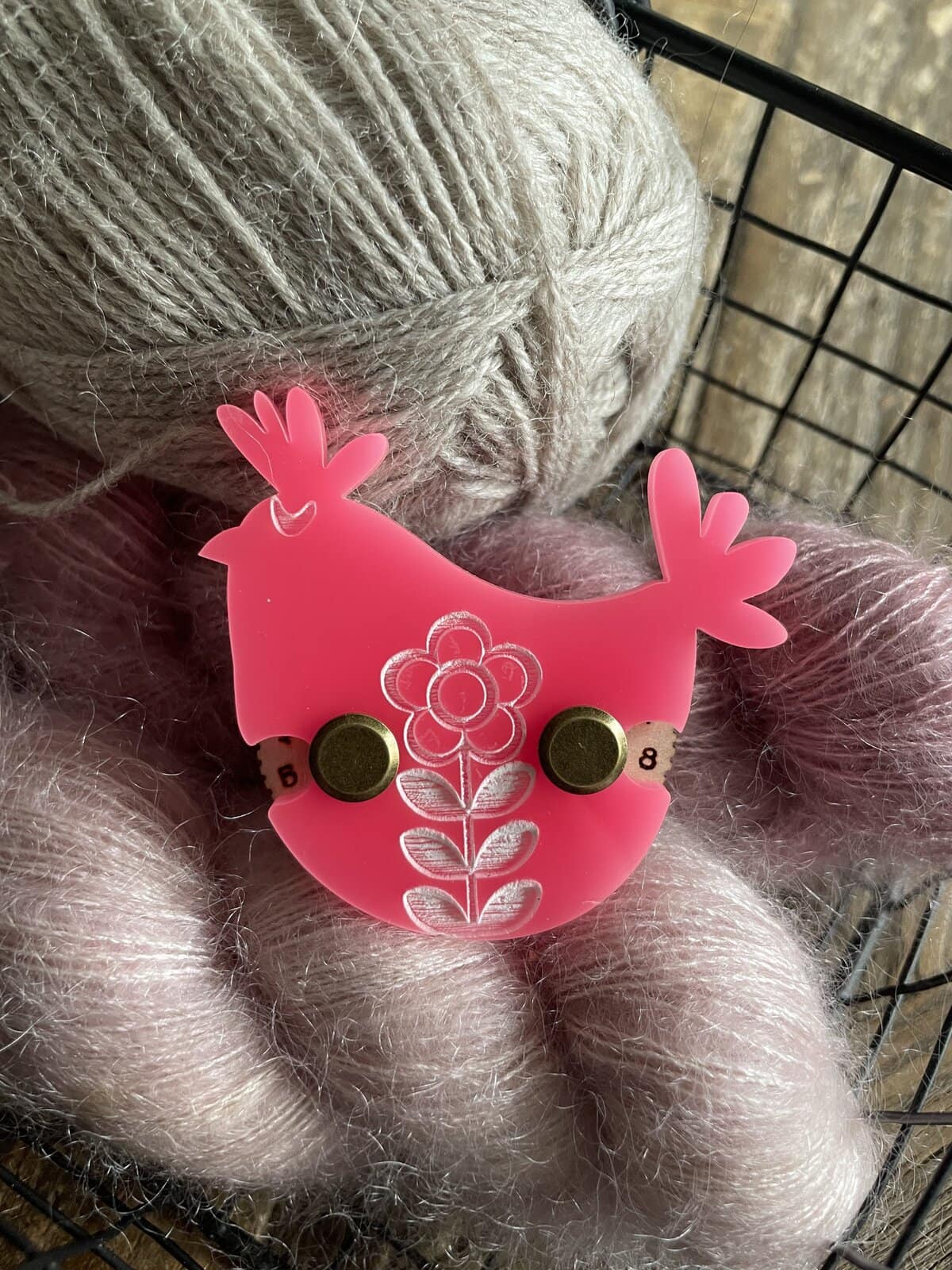 Soft cream-colored yarn ball for knitting or crochet projects.
