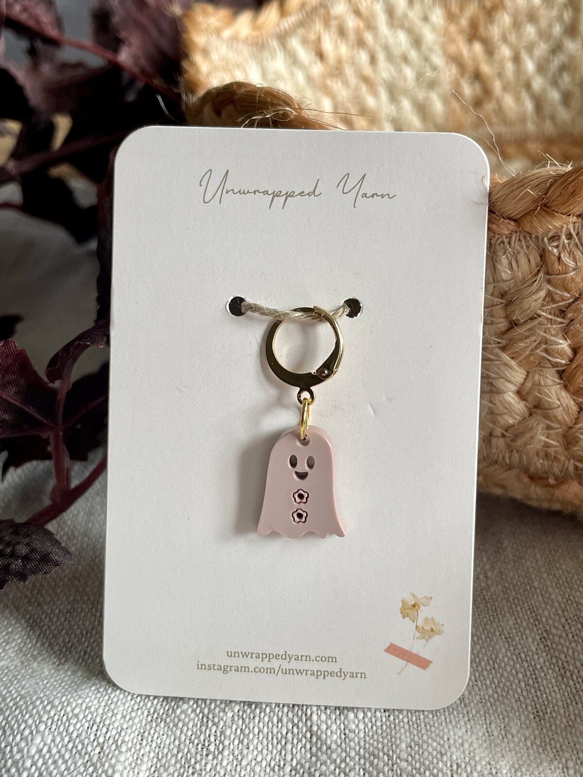 Whimsical ghost-shaped jewelry charm on card, perfect for Halloween or spooky-themed accessories.