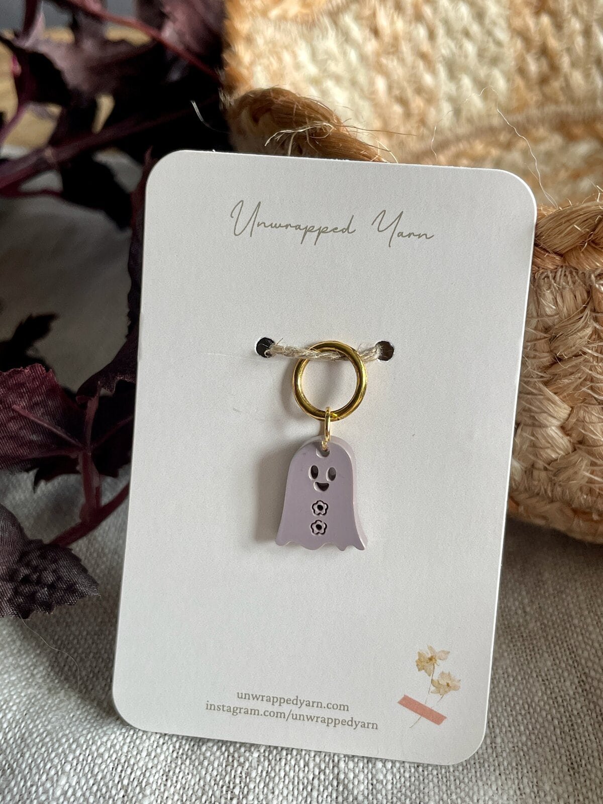 Colorful ghost-shaped enamel keychain with gold ring, perfect for yarn lovers or as a cute accessory.