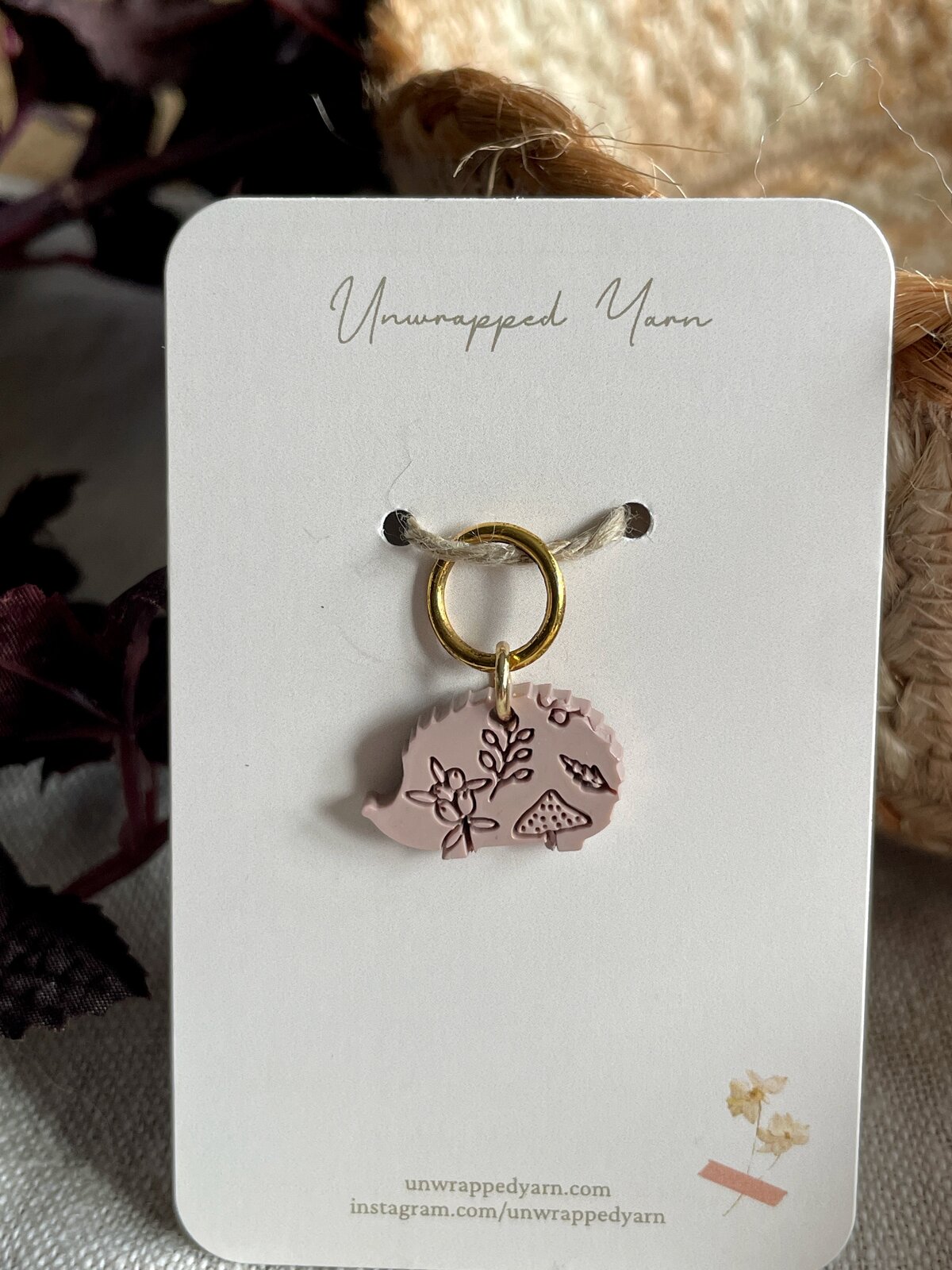 Delicate pink resin pig charm with floral and mushroom details.