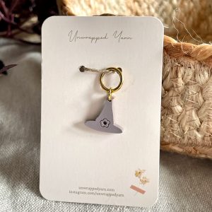 Soft gray witch hat charm, perfect for yarn lover accessories and craft projects.