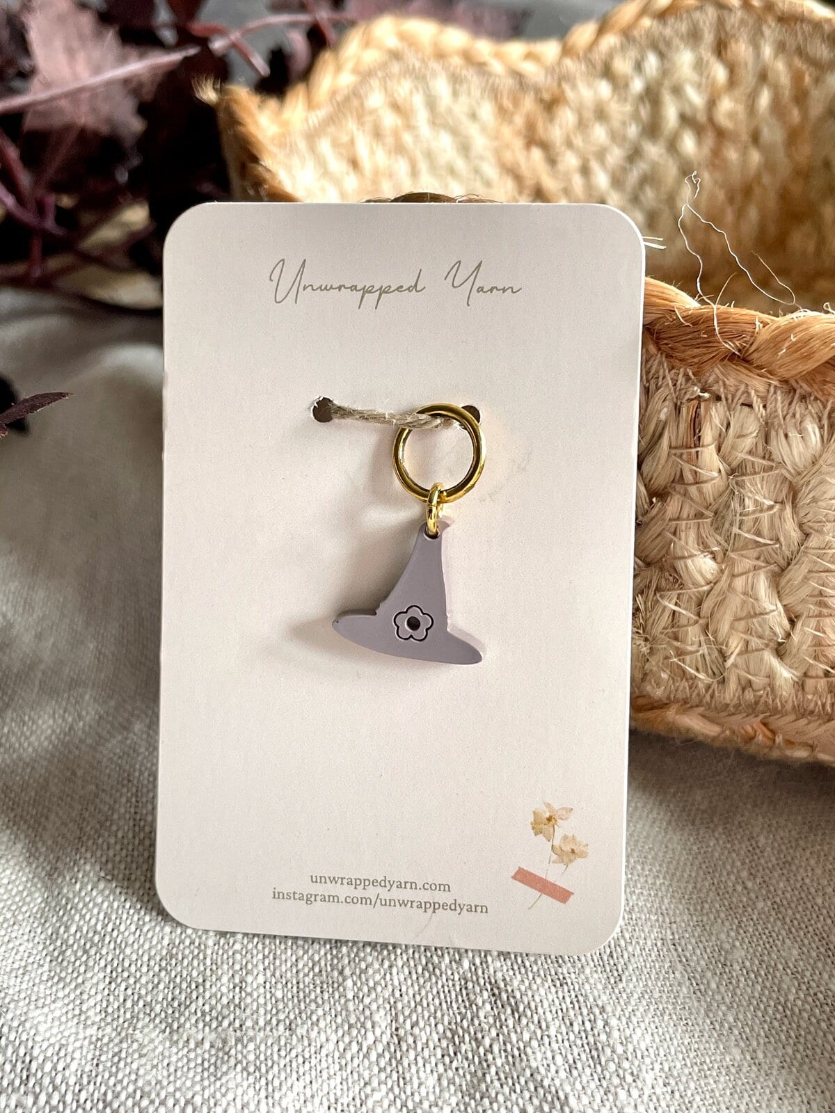 Soft gray witch hat charm, perfect for yarn lover accessories and craft projects.