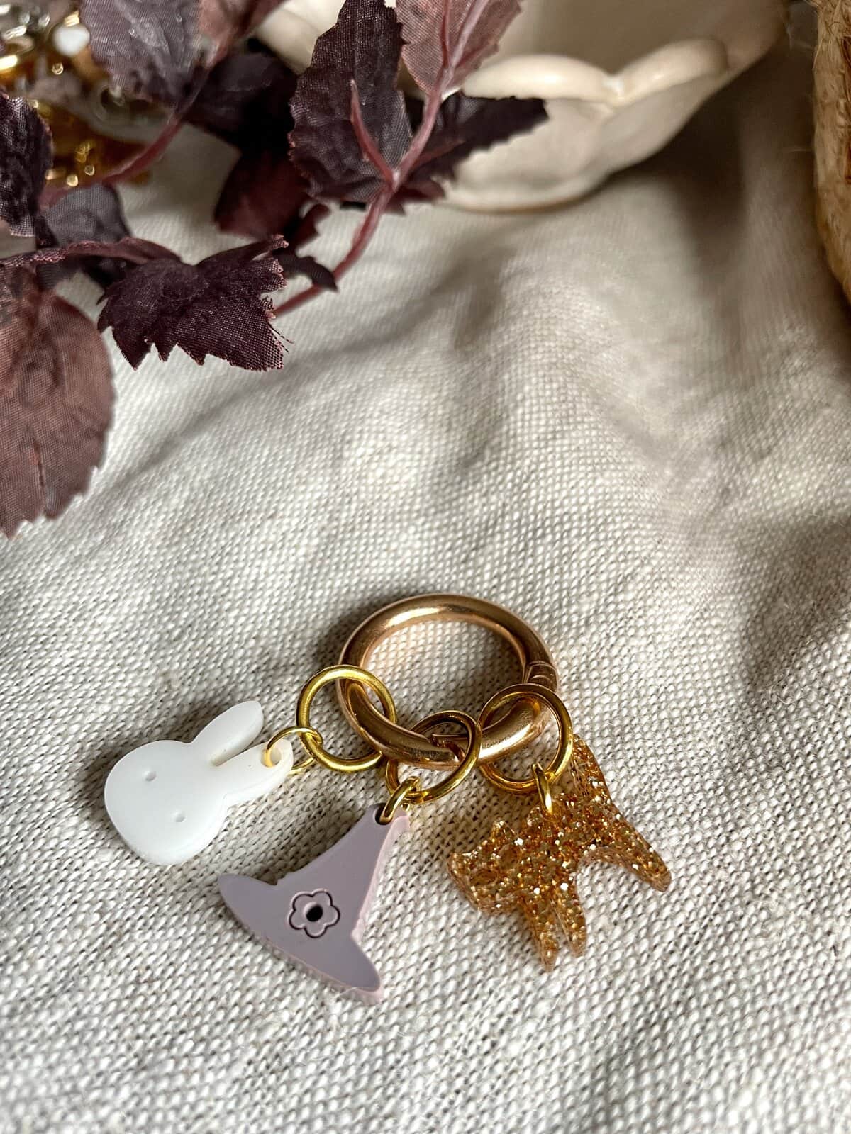 Brighten your accessories with cute, glittery charms on stylish rings for a fashionable look.