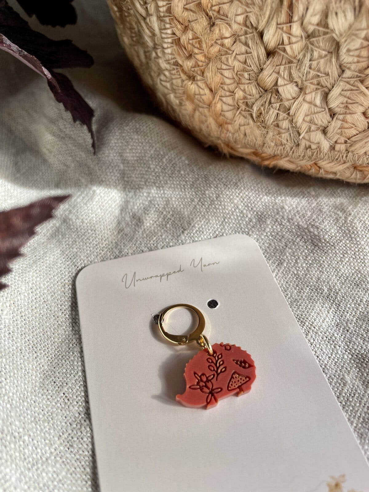 Colorful resin keychain with floral design on a white background.
