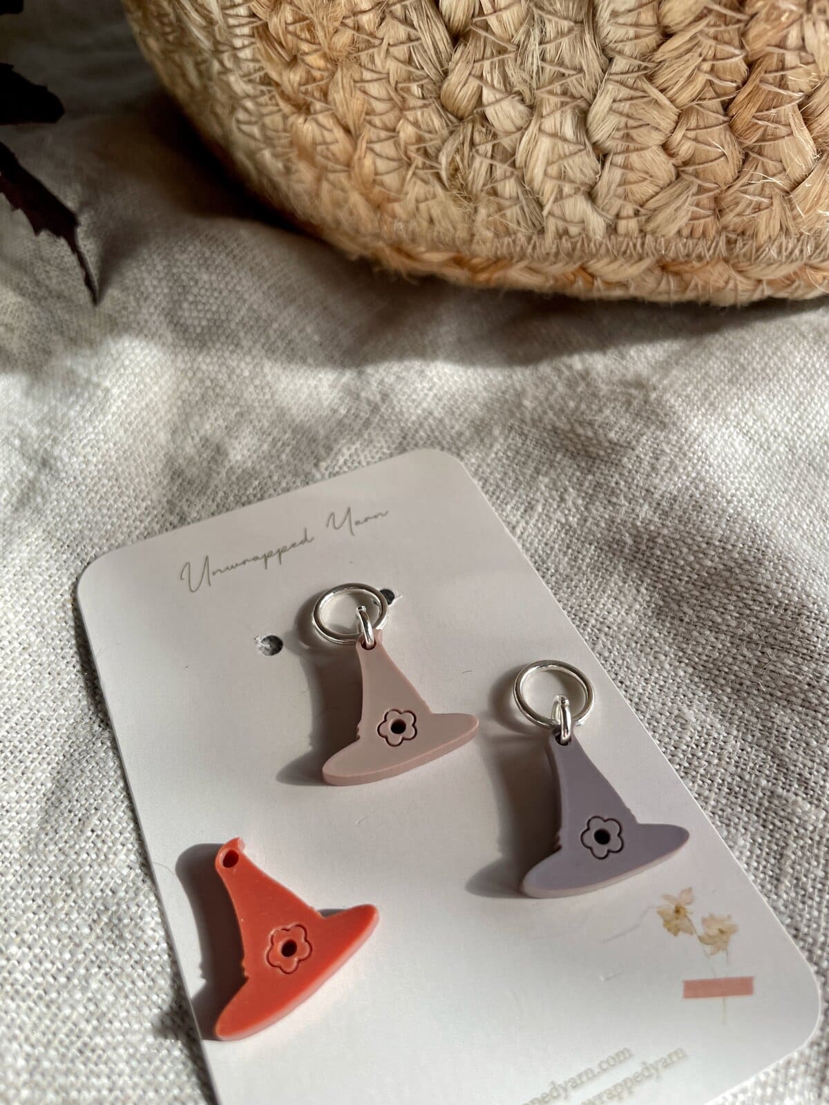Soft pink, lavender, and coral yarn-shaped earrings, minimalist accessories with floral design.