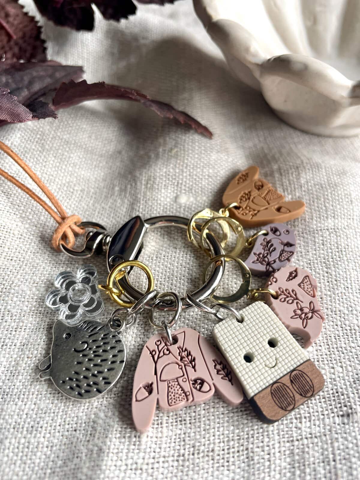 Colorful charm bracelet with silicone and metal charms, perfect for jewelry lovers and craft enthusiasts.