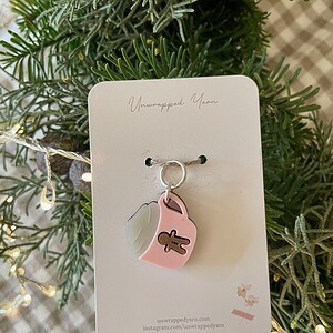 Cute handmade gift idea, gingerbread man charm on pink and transparent acrylic pendant, perfect for holiday cheer.