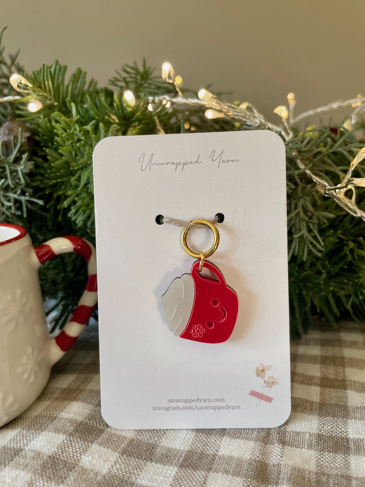 Festive holiday keychain with whipped cream and red soda can design, perfect for Christmas cheer and gift-giving.